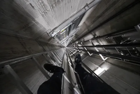 Rooftopper climbing elevator shaft