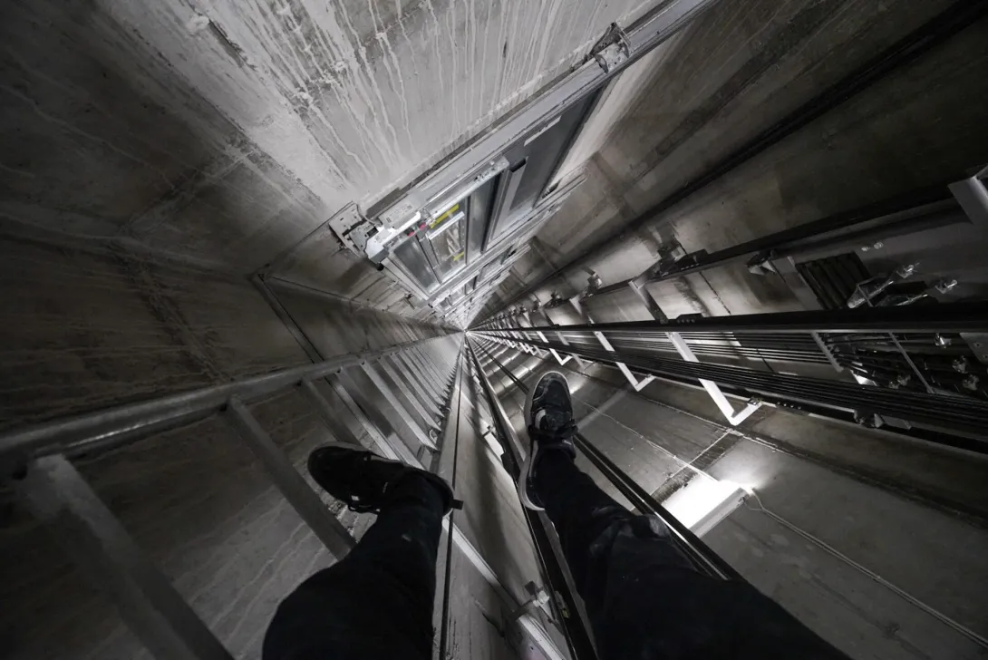 Rooftopper climbing elevator shaft